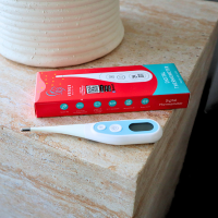 woman using smart body fat scale health monitoring device